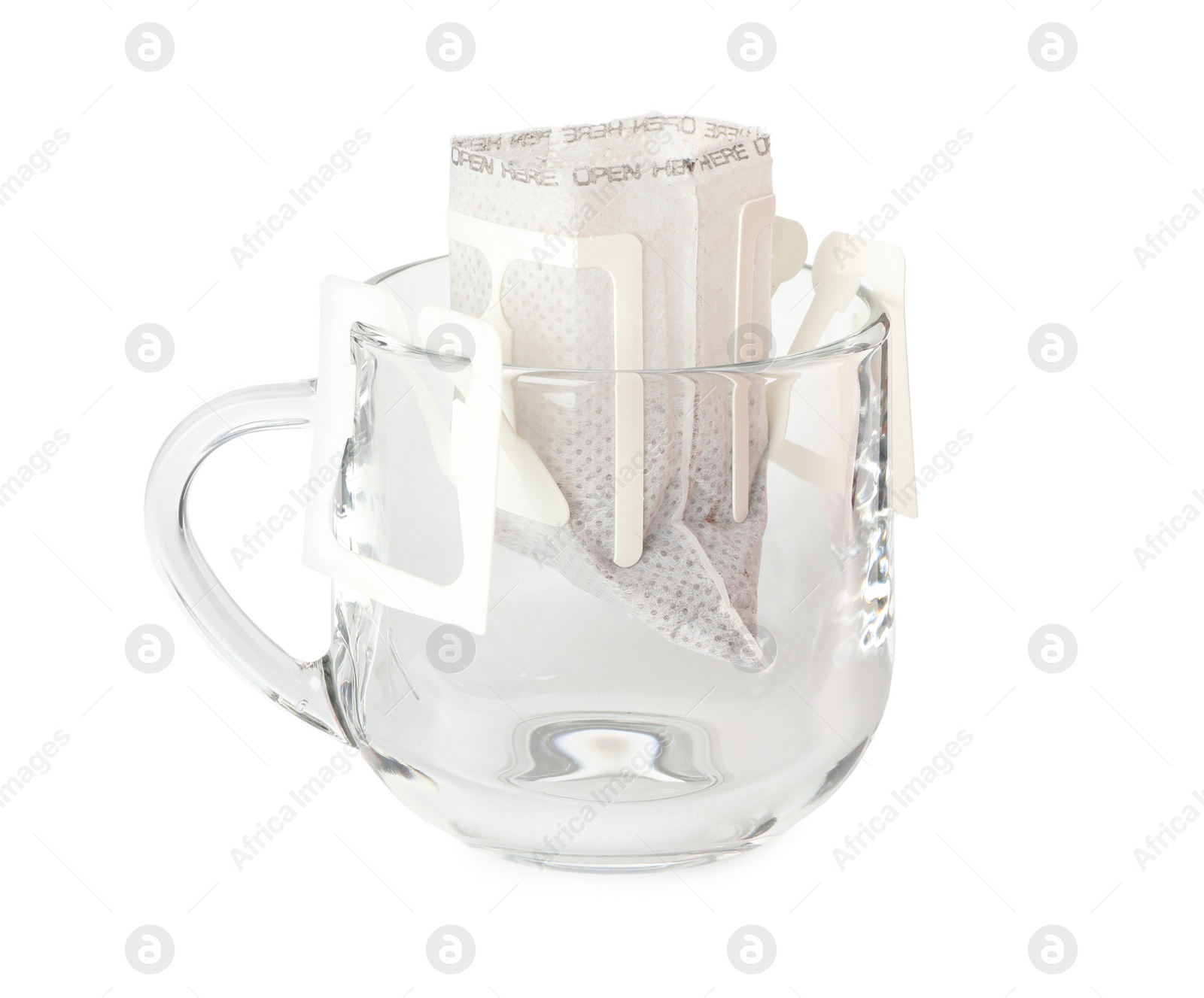 Photo of Glass cup with drip coffee bag isolated on white