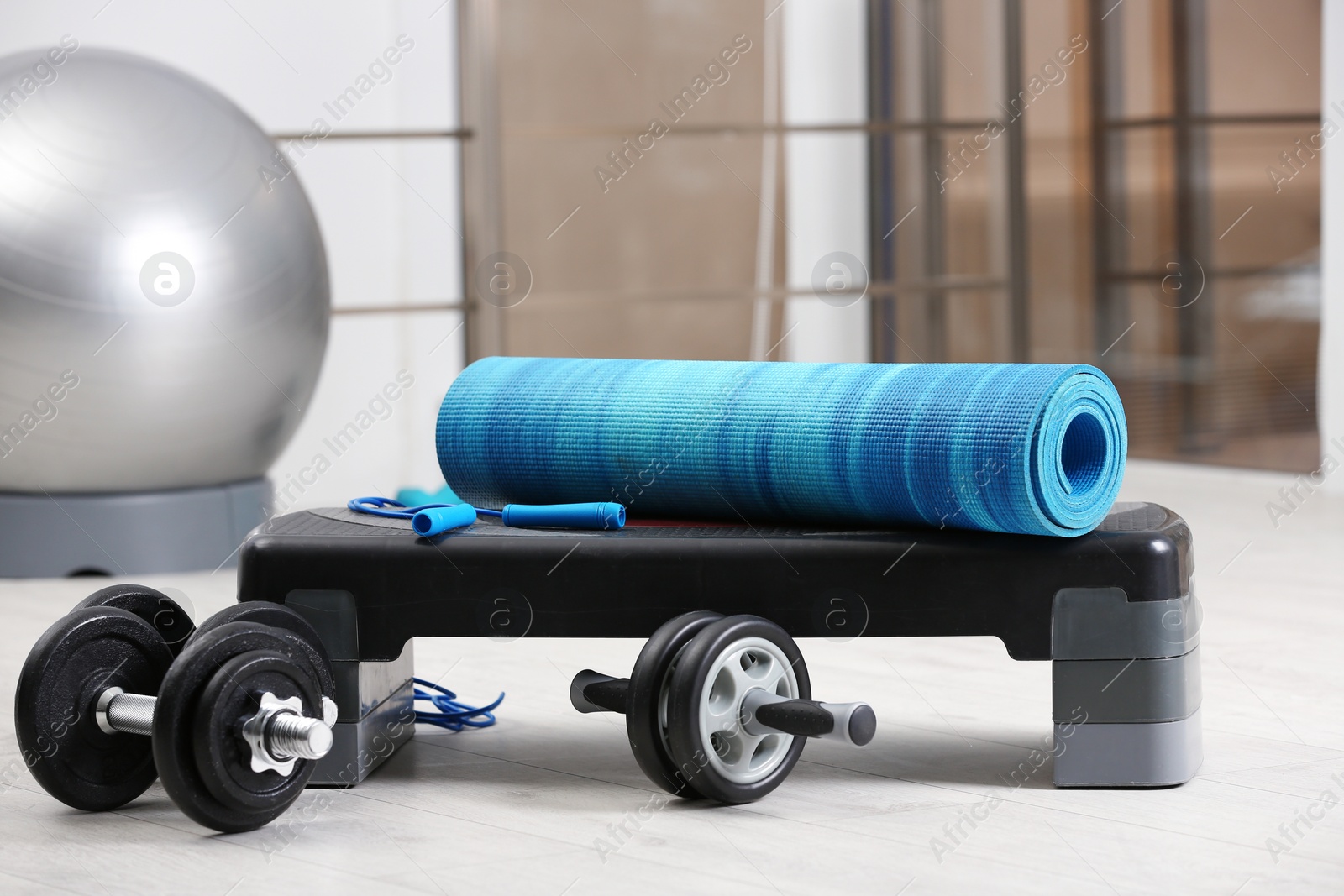 Photo of Set of fitness equipment of floor indoors