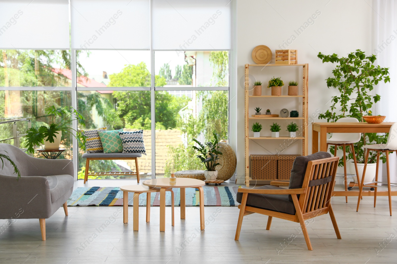 Photo of Modern living room interior with comfortable couch and wooden furniture