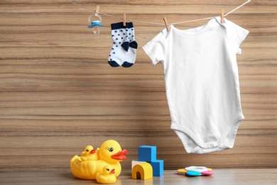 Photo of Composition with baby accessories on wooden background