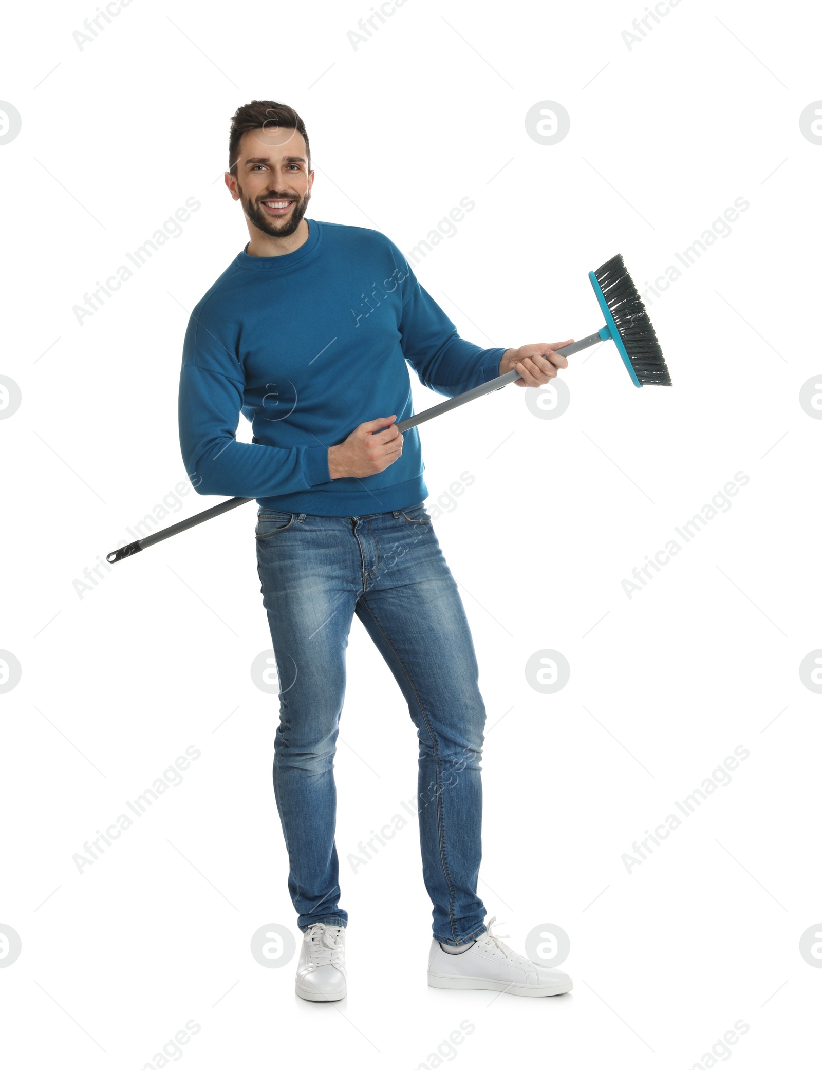 Photo of Handsome man with broom on white background