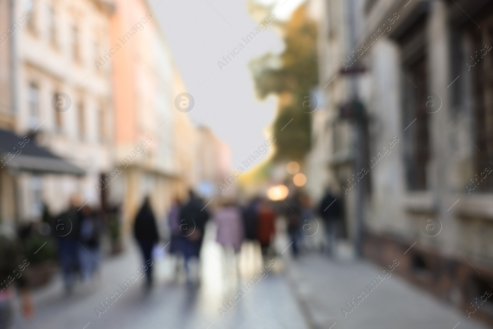 Photo of Blurred view of people walking on city street