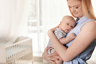 Happy mother and her baby at home