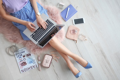 Photo of Female beauty blogger with laptop indoors, top view