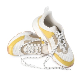 Photo of Pair of stylish shoes with laces on white background