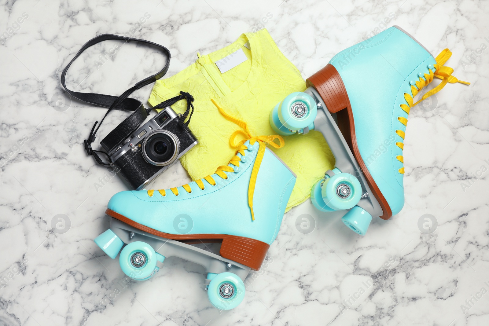 Photo of Flat lay composition with quad roller skates on marble background