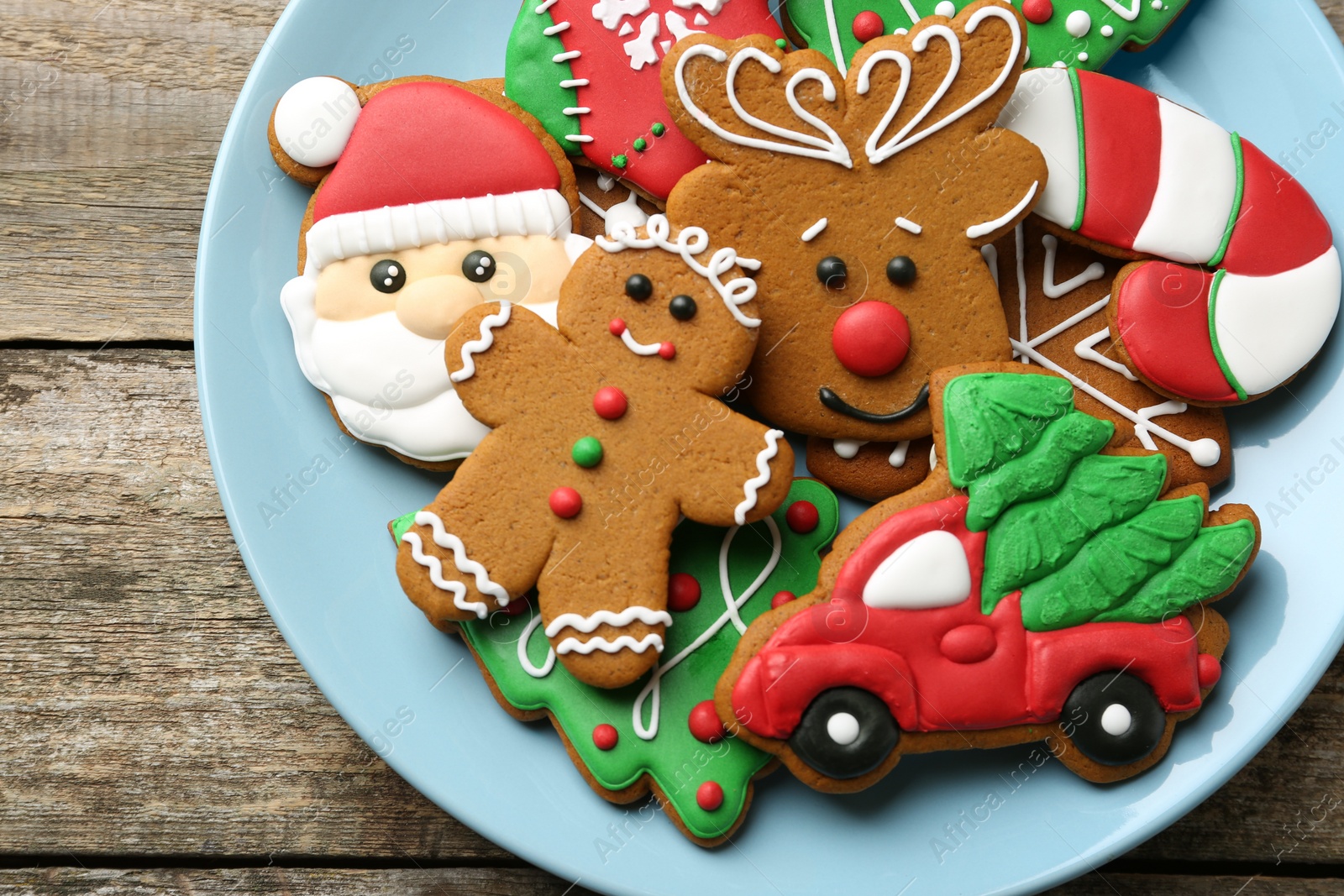 Photo of Different tasty Christmas cookies on wooden table, top view. Space for text