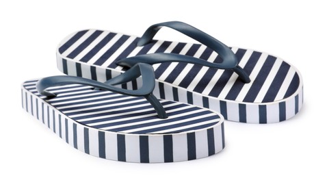Photo of Pair of striped flip flops on white background