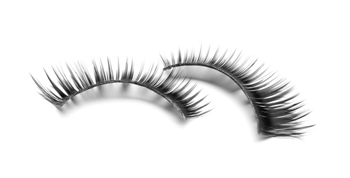 Beautiful pair of false eyelashes on white background