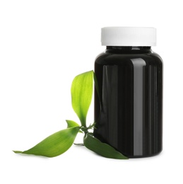 Bottle for vitamin pills and green leaves on white background