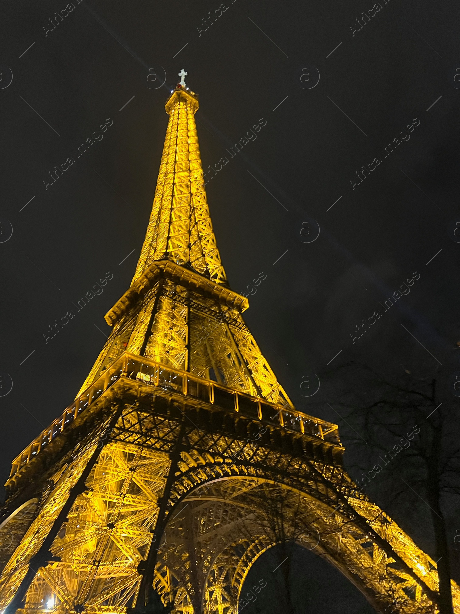 Photo of Beautiful illuminated Eiffel tower against night sky, low angle view