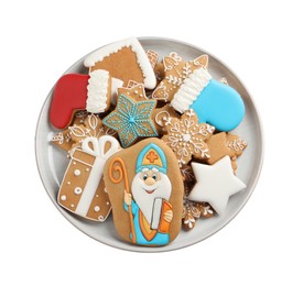 Tasty gingerbread cookies on white background, top view. St. Nicholas Day celebration