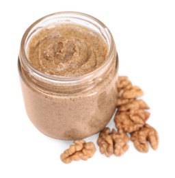 Tasty nut paste in jar and walnuts isolated on white