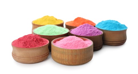 Photo of Colorful powder dyes in bowls on white background. Holi festival