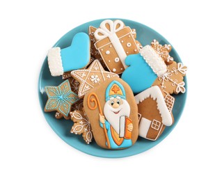 Photo of Tasty gingerbread cookies on white background, top view. St. Nicholas Day celebration