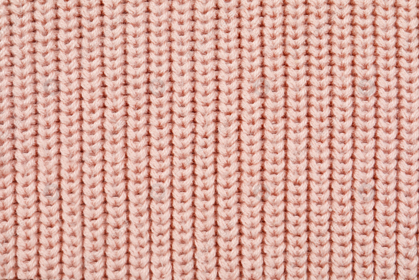 Photo of Texture of cozy warm sweater as background, closeup