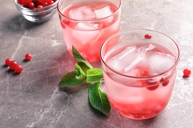 Refreshing natural lemonade in glasses on table