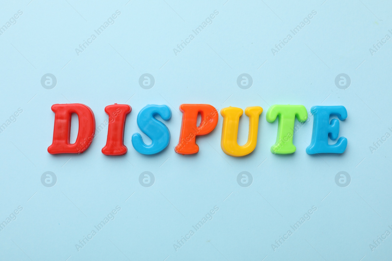 Photo of Word Dispute made of colorful letters on light blue background, flat lay