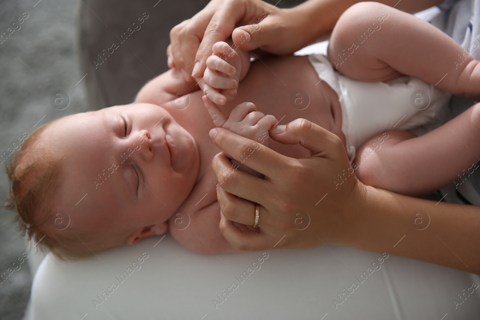 Photo of Mother with her newborn baby, closeup view