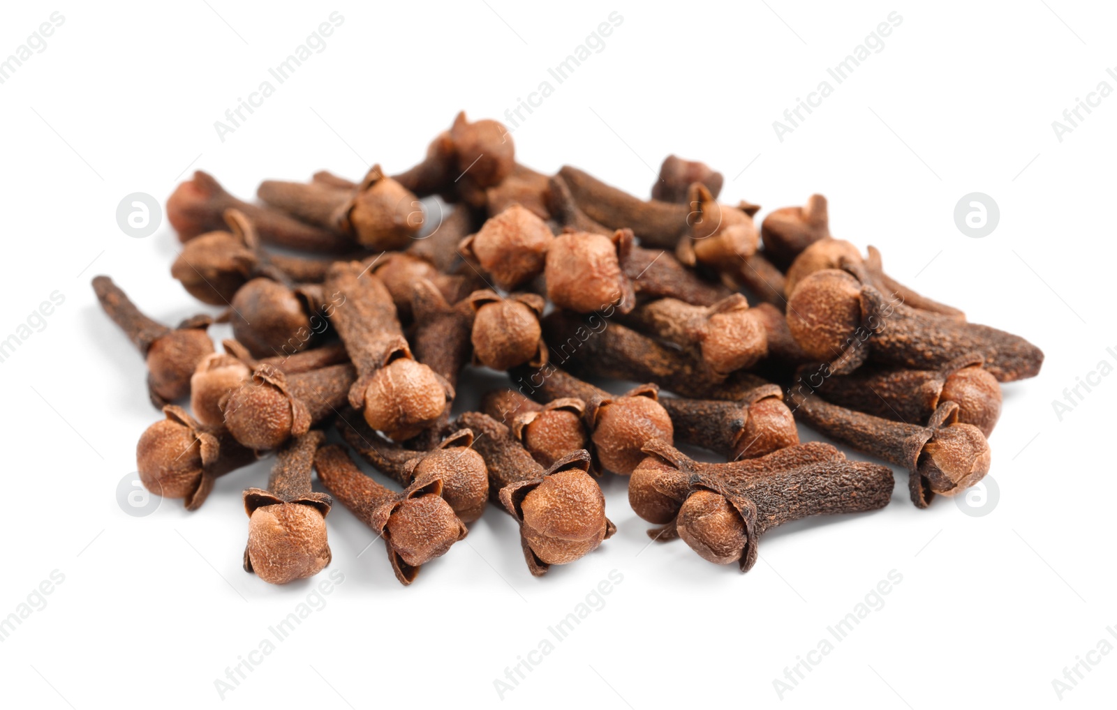 Photo of Pile of aromatic dry cloves on white background