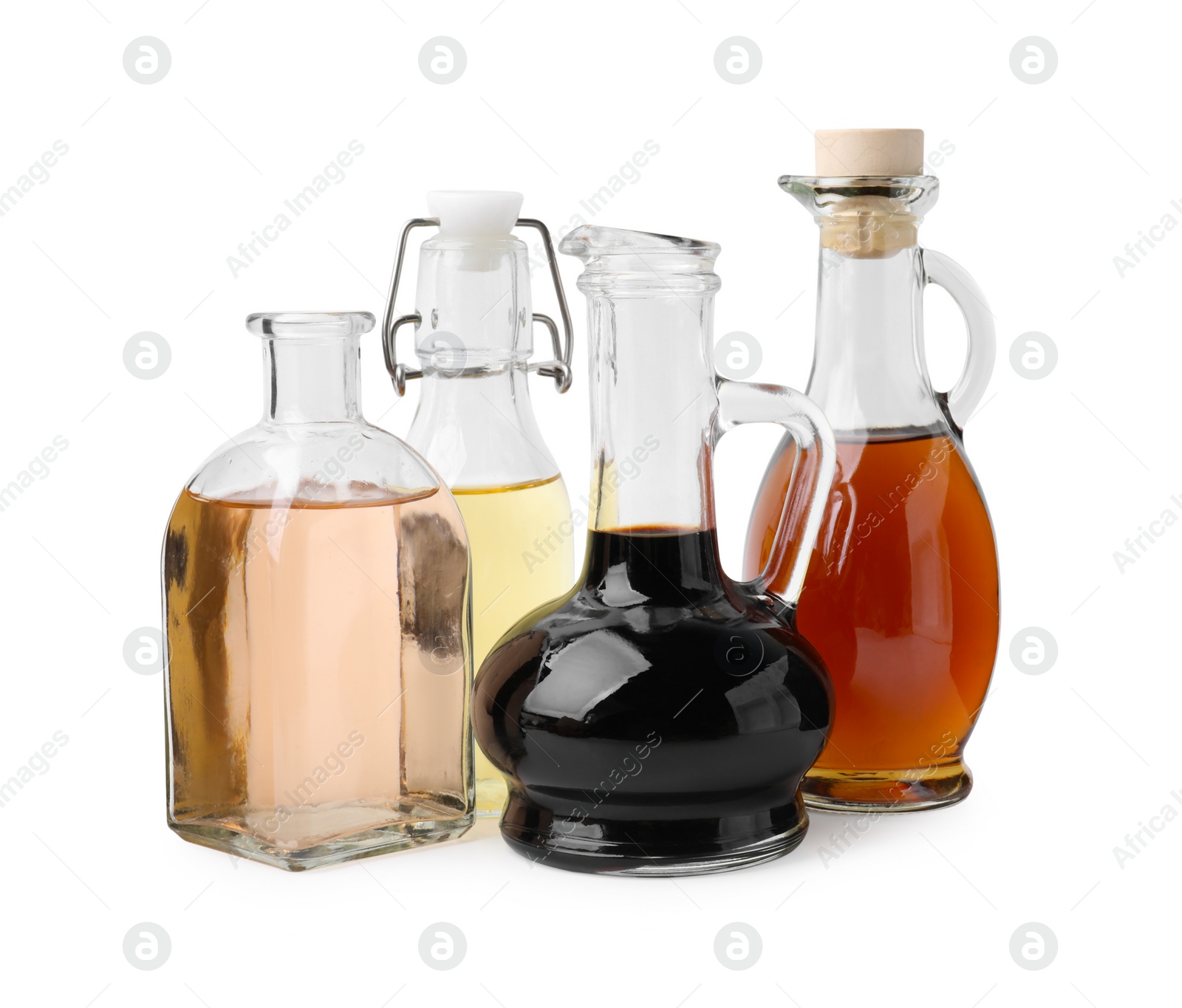 Photo of Different types of vinegar isolated on white