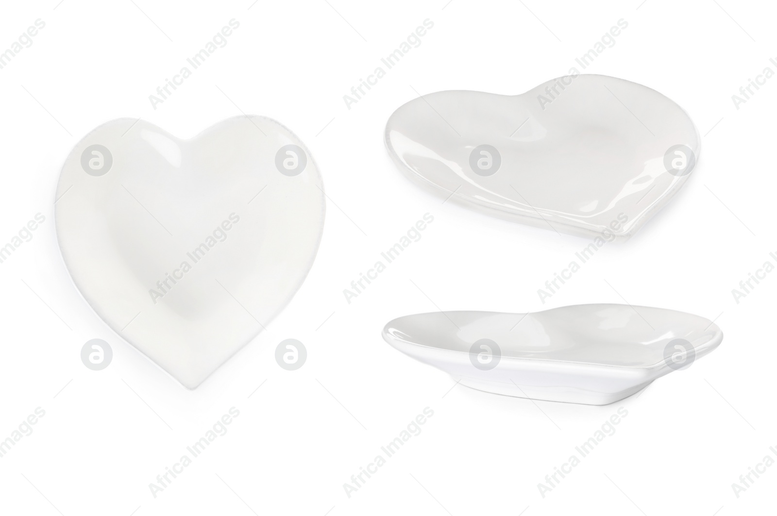 Image of Set with empty heart shaped plates on white background