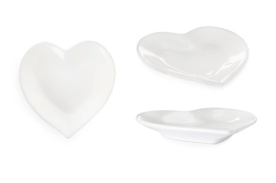 Image of Set with empty heart shaped plates on white background