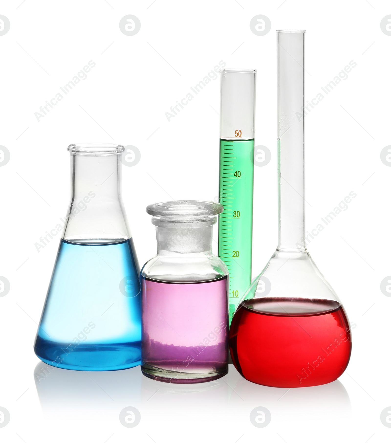 Photo of Laboratory glassware with colorful liquids on white background