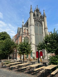 Photo of Leiden, Netherlands - August 28, 2022; Beautiful view of Hooglandse Kerk and trees on sunny day