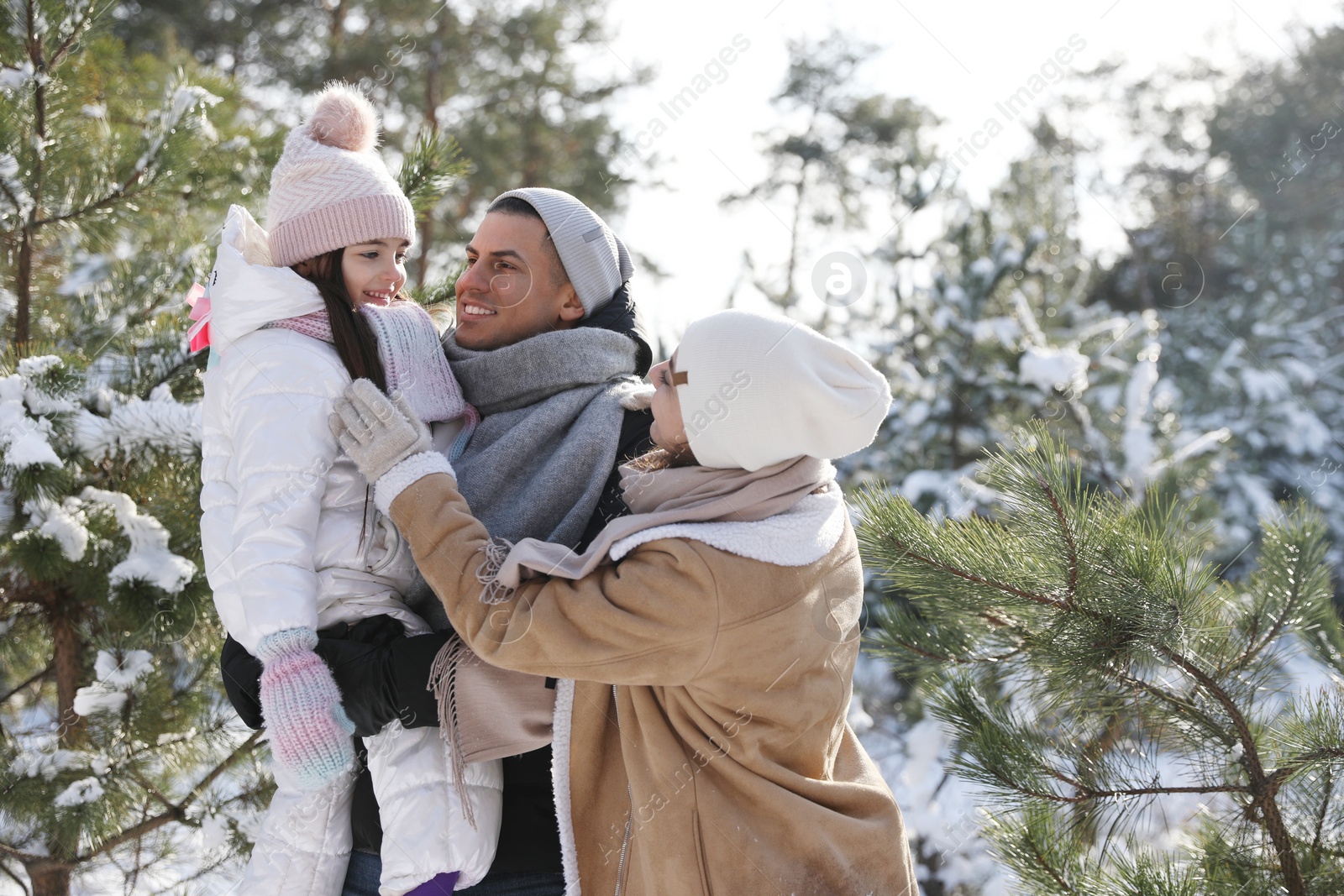 Photo of Happy family outdoors on winter day. Christmas vacation