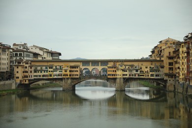 Florence, Italy - February 8, 2024: Picturesque view of city with beautiful buildings and river