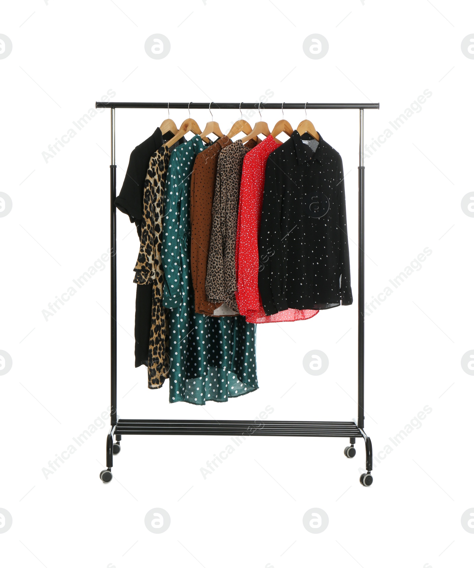 Photo of Rack with stylish women's clothes isolated on white