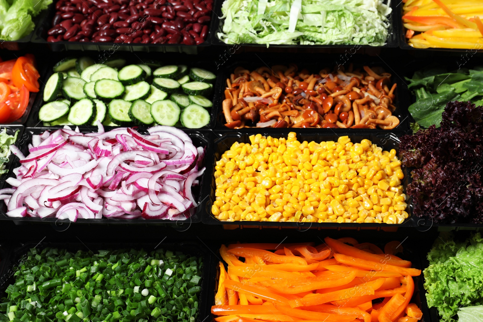 Photo of Salad bar with different fresh ingredients as background