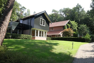 Picturesque view of beautiful house and plants on sunny day