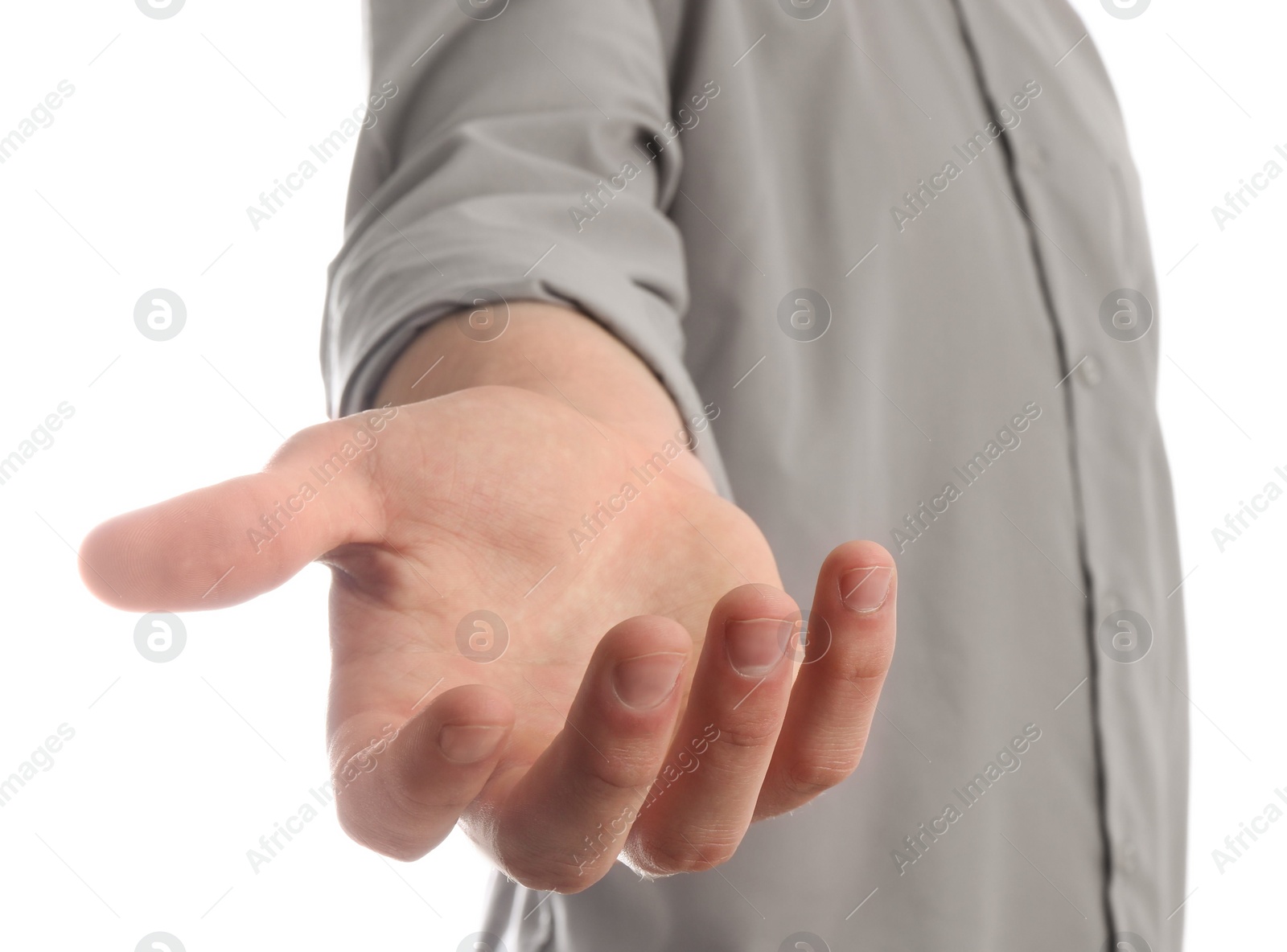 Photo of Man holding something in his hand on white background, closeup