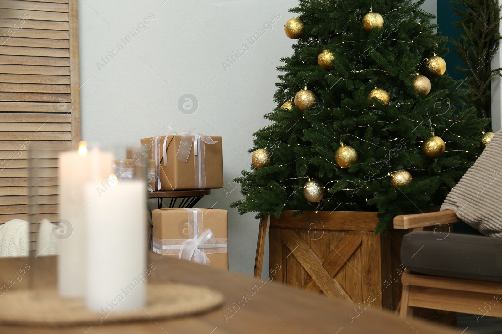 Photo of Beautiful decorated Christmas tree in living room