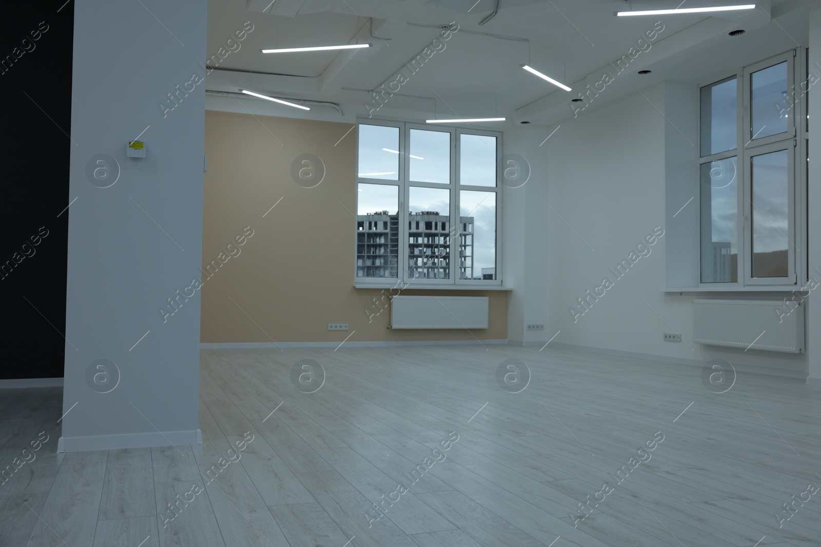 Photo of New empty room with clean windows and light walls