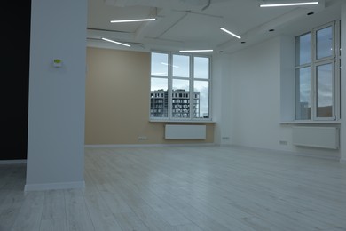 Photo of New empty room with clean windows and light walls