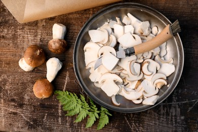 Photo of Flat lay composition with mushrooms and knife on wooden table