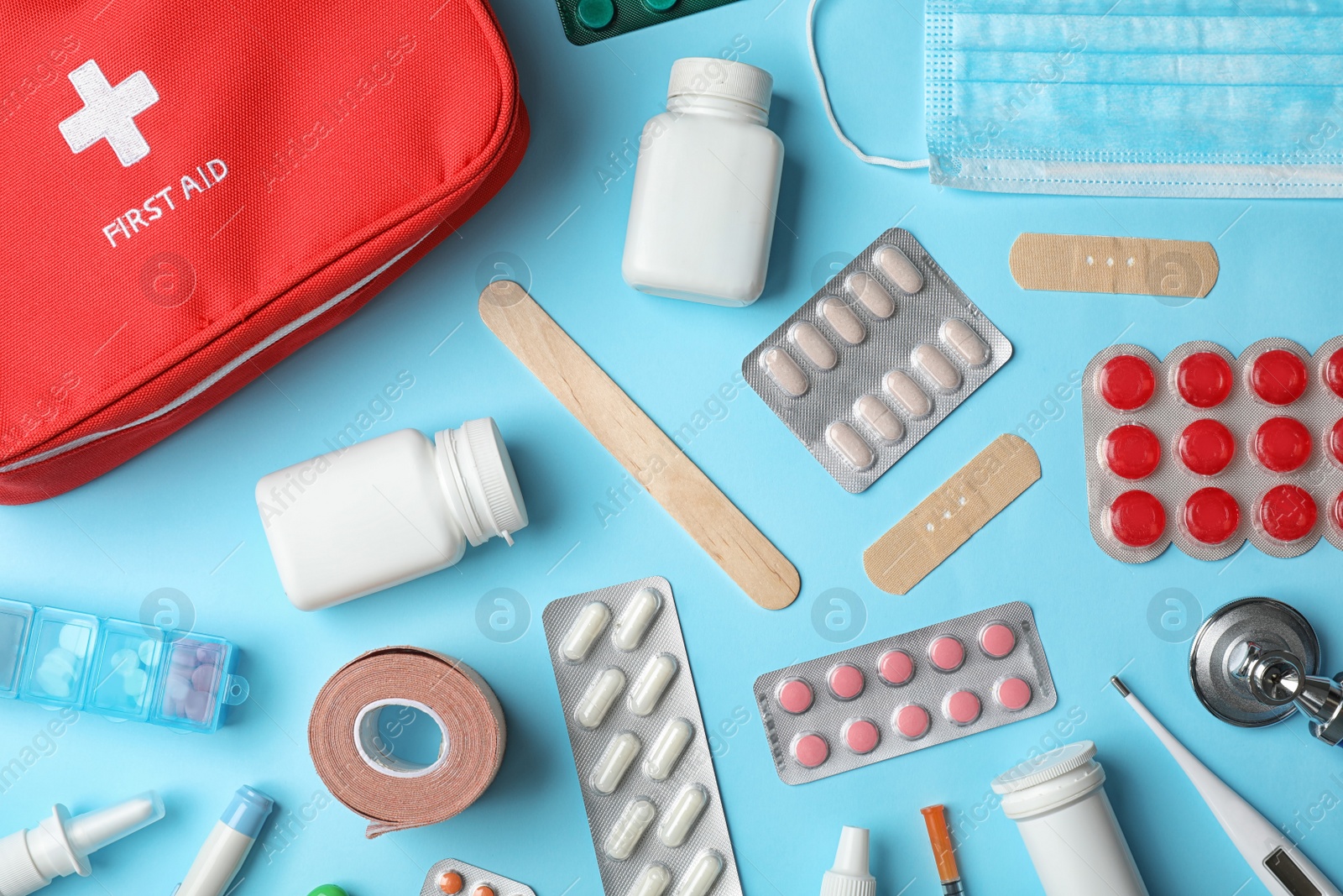 Photo of Flat lay composition with first aid kit on color background