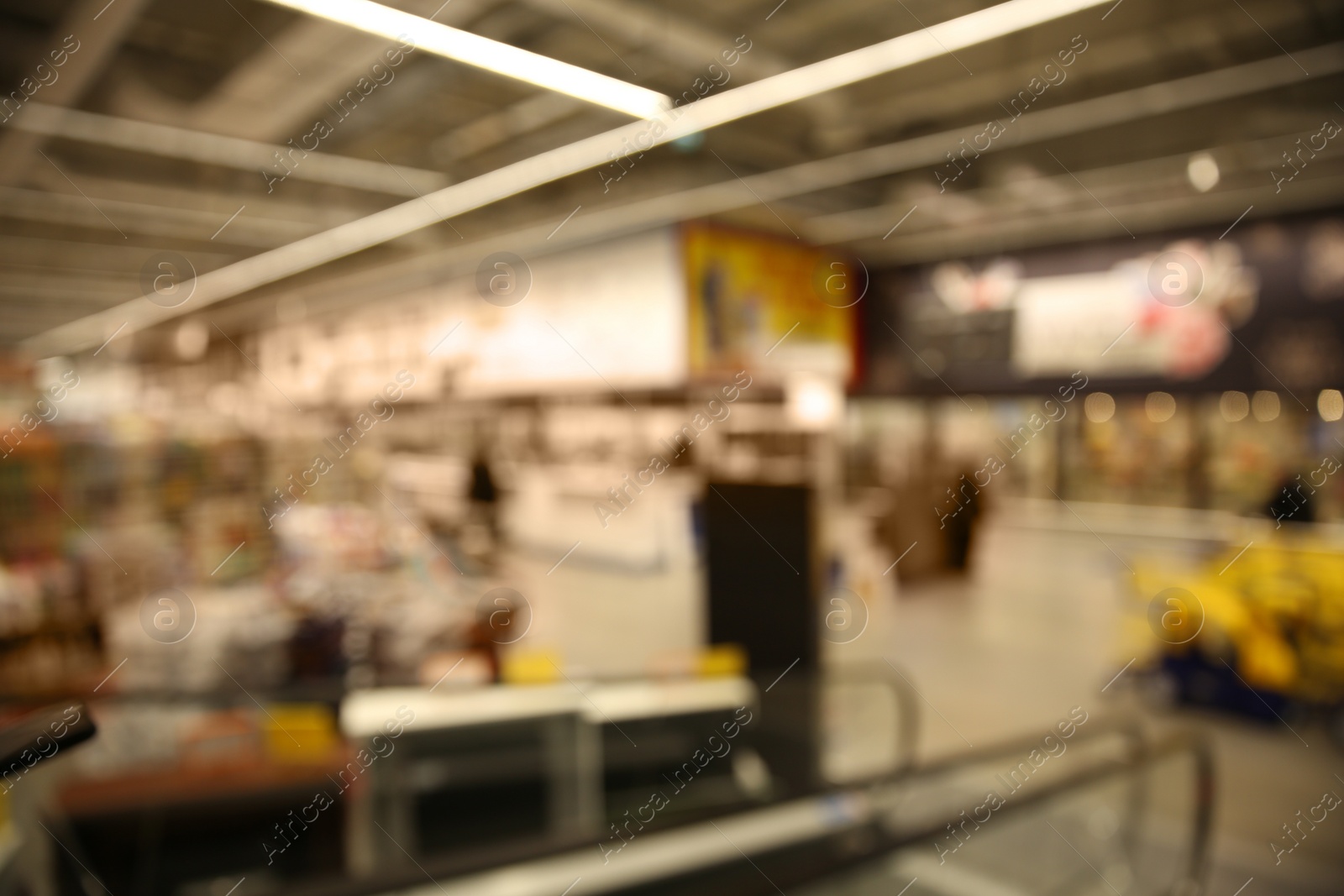 Photo of Blurred view of modern shopping mall interior