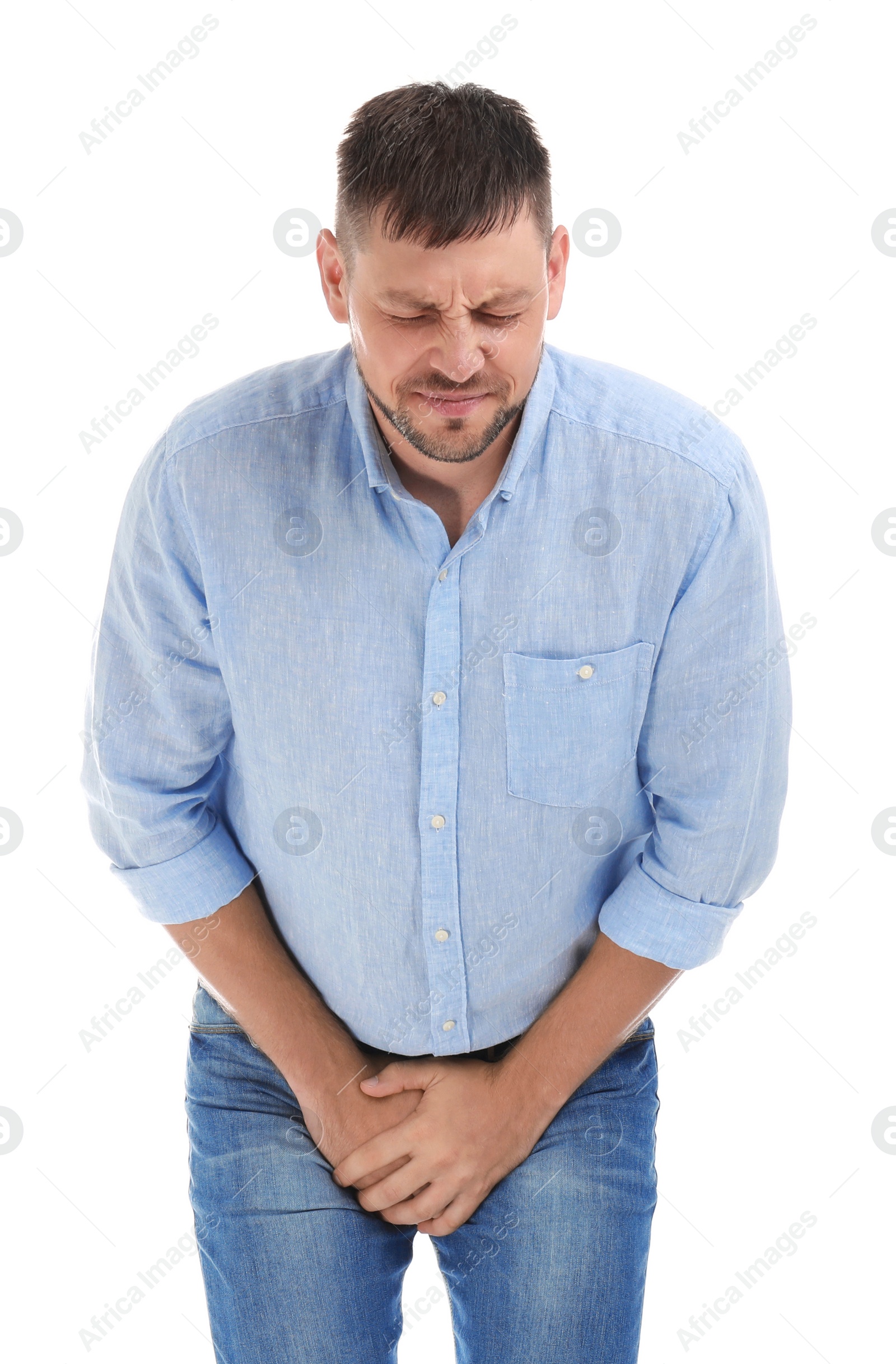 Photo of Man suffering from pain on white background. Urology problems