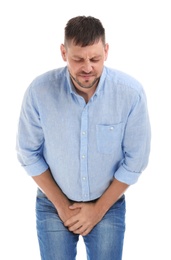 Man suffering from pain on white background. Urology problems