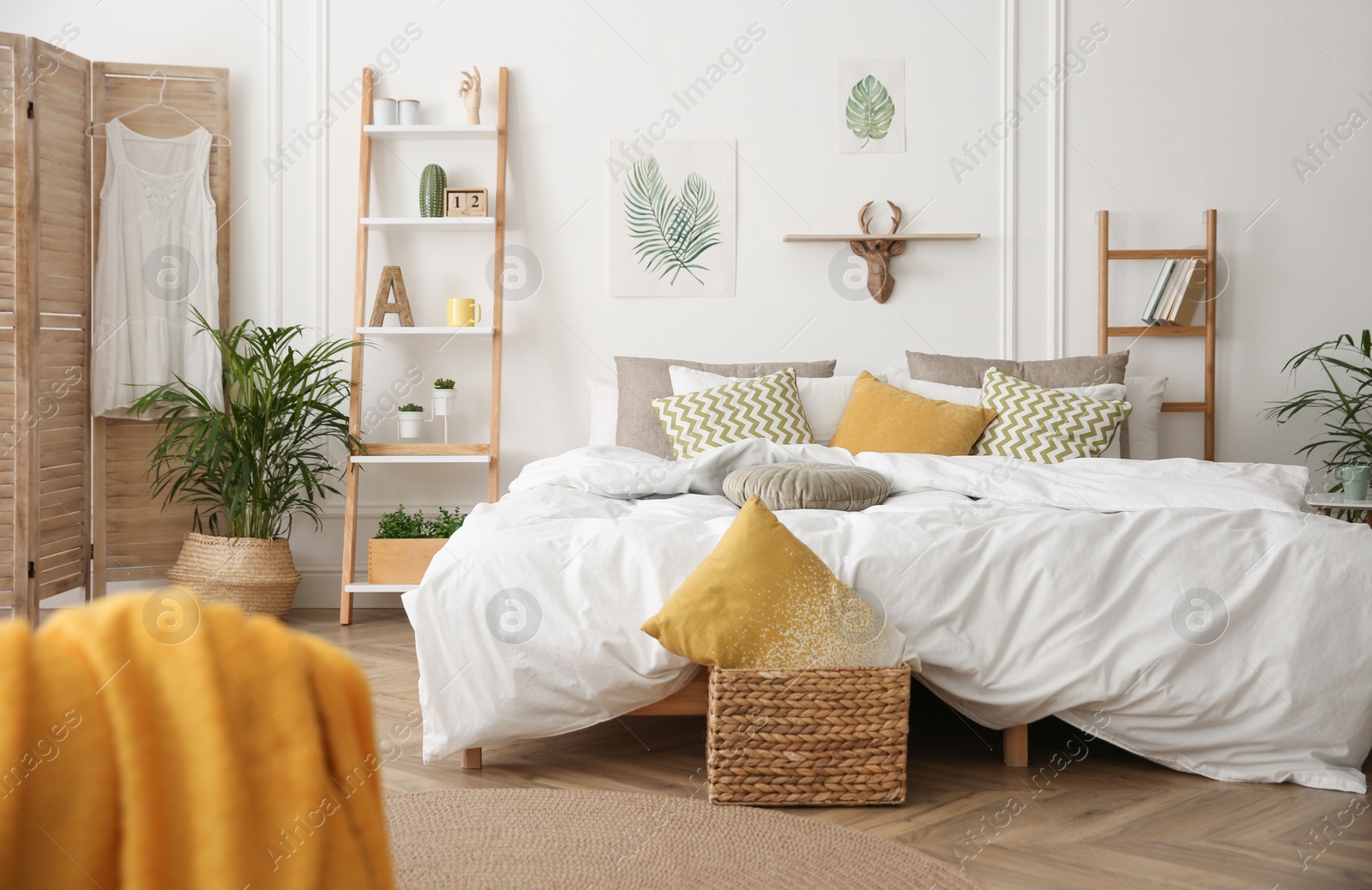 Photo of Modern bedroom with beautiful fresh house plants