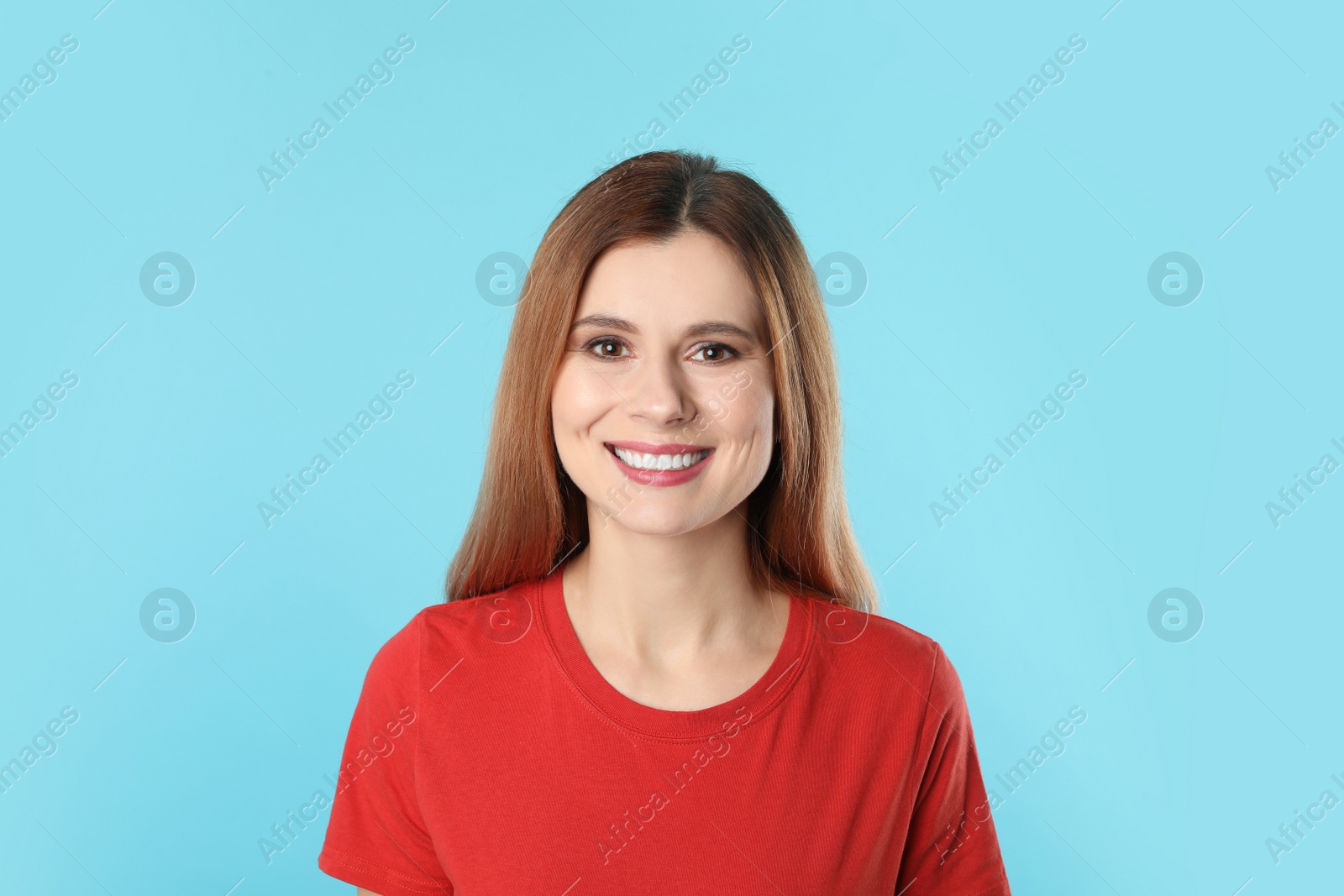 Photo of Smiling woman with perfect teeth on color background