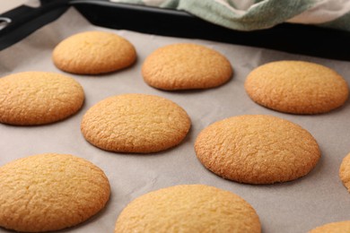 Photo of Delicious Danish butter cookies on baking tray, closeup