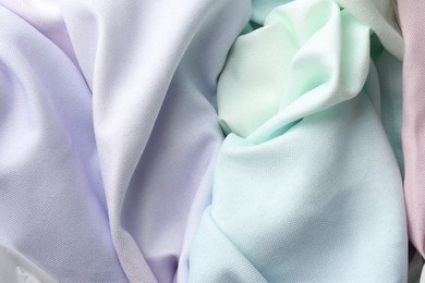 Photo of Different crumpled fabrics as background, top view