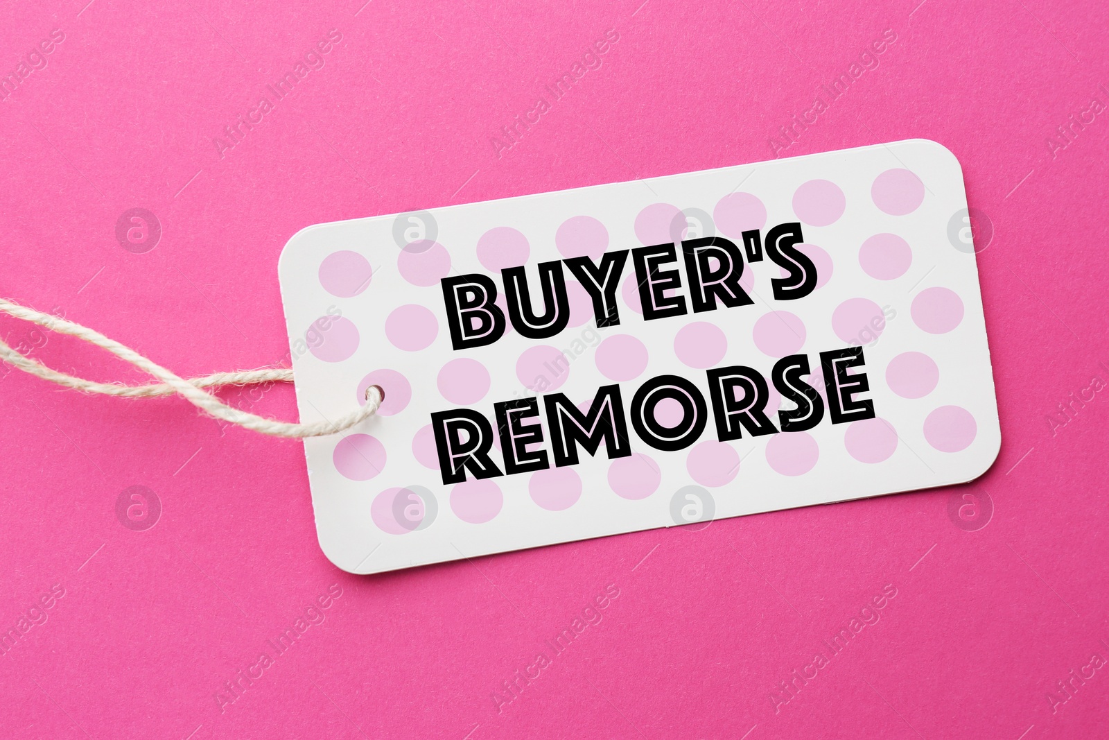 Image of Tag with text Buyer's Remorse on hot background, top view