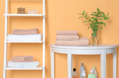 Photo of Clean towels in bathroom