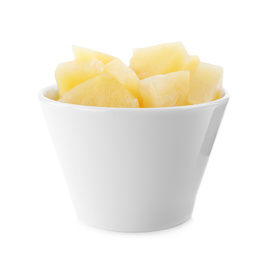 Photo of Pieces of delicious canned pineapple in bowl on white background